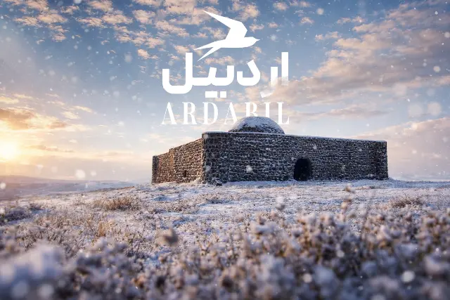 کاروانسرای سنگی صائین اردبیل در میان دشت پر از گل