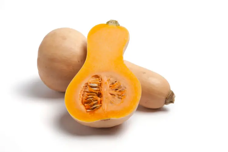 کدو حلوایی (Butternut Squash) کامل و یک عدد کدو نصف شده با گوشت نارنجی