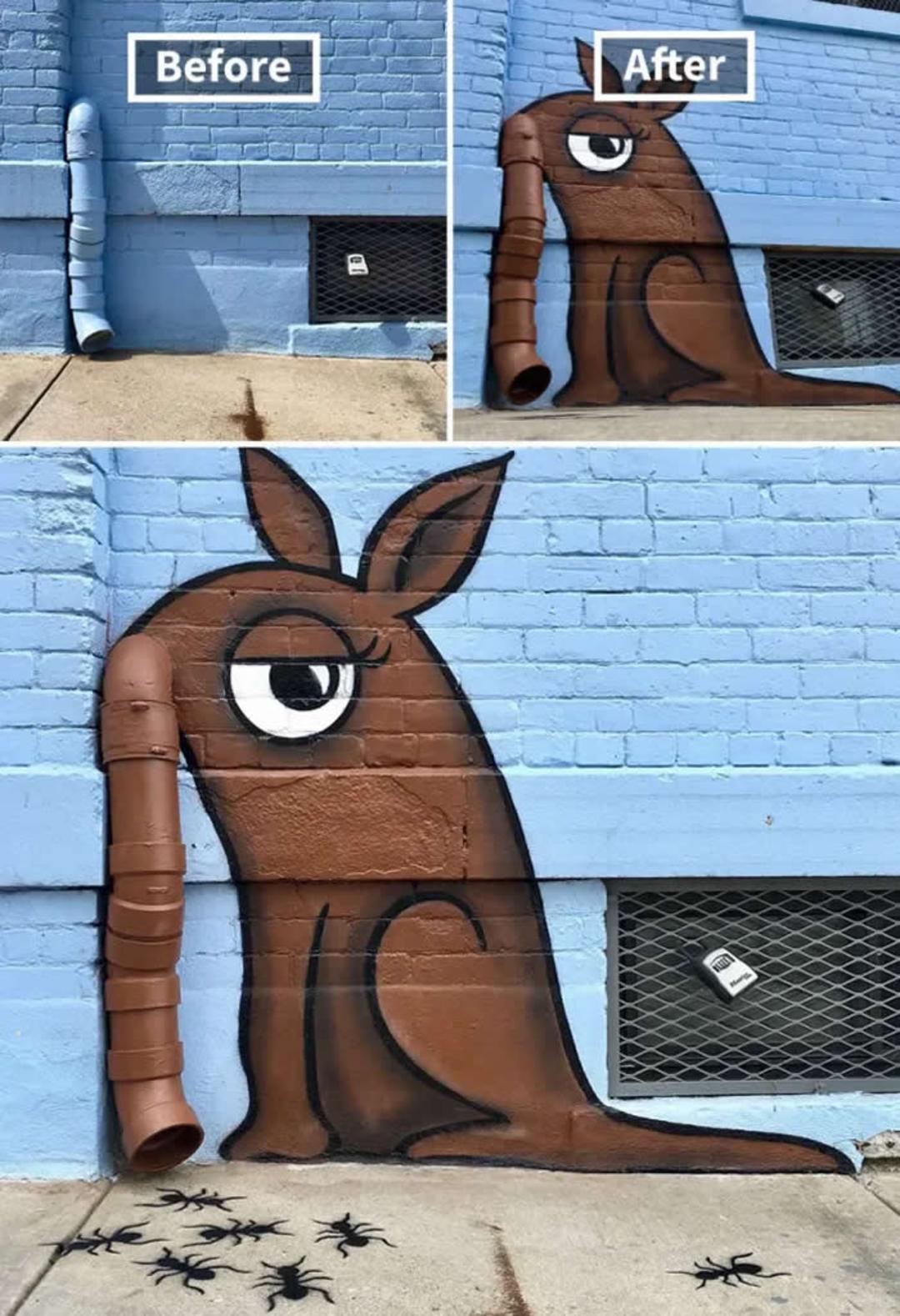 نقاشی گرافیتی کانگوروی (Kangaroo) روی دیوار آبی با استفاده از لوله فاضلاب