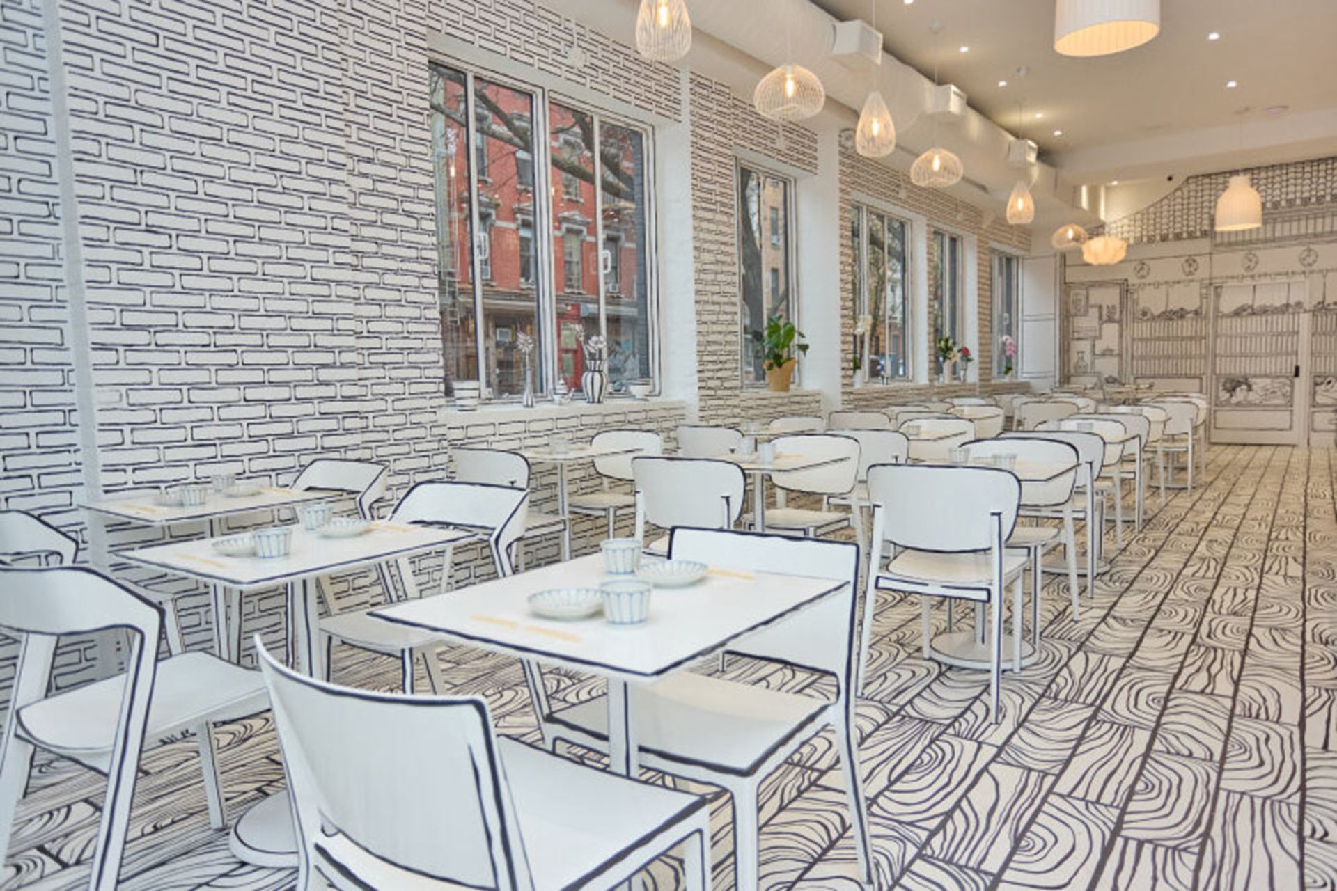 فضای داخلی رستوران با طراحی دو‌ بعدی سیاه‌ و سفید